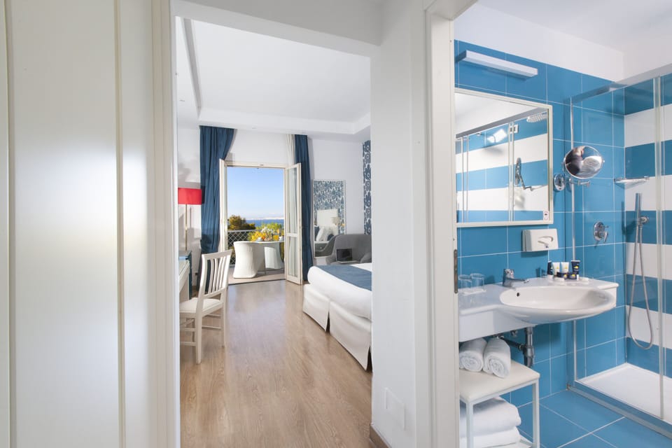 Standard Double Room, Balcony, Partial Sea View | Hypo-allergenic bedding, down comforters, minibar, in-room safe