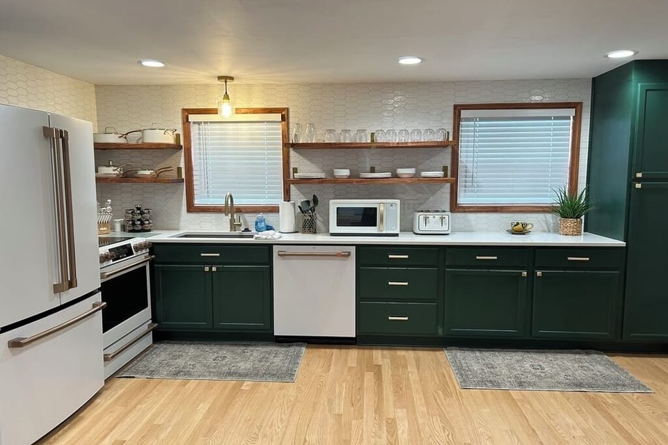 Remodeled kitchen with new cabinets and Cafe Appliances, open shelving & pantry.