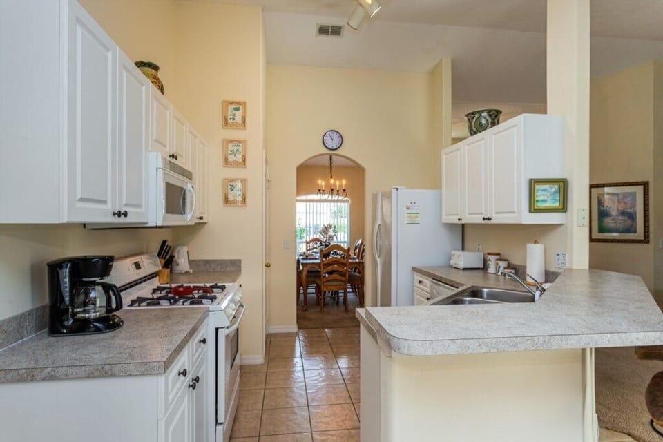 Fully equipped kitchen with open access to the dining area.