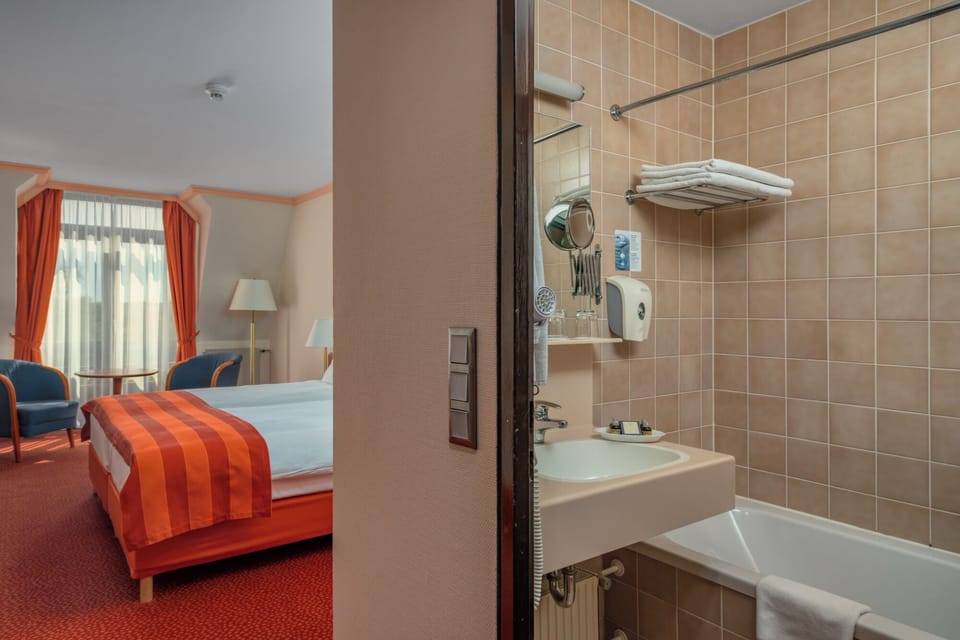 Bathtub, free toiletries, hair dryer, bathrobes