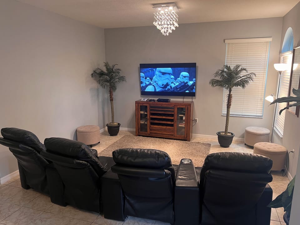 Cinema night in front of the 65" smart TV and PS games console for gaming night.