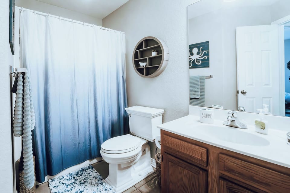 The guest full bathroom has a shower and tub.