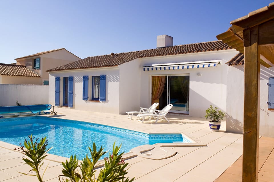 Enjoy lounging around your outdoor pool.