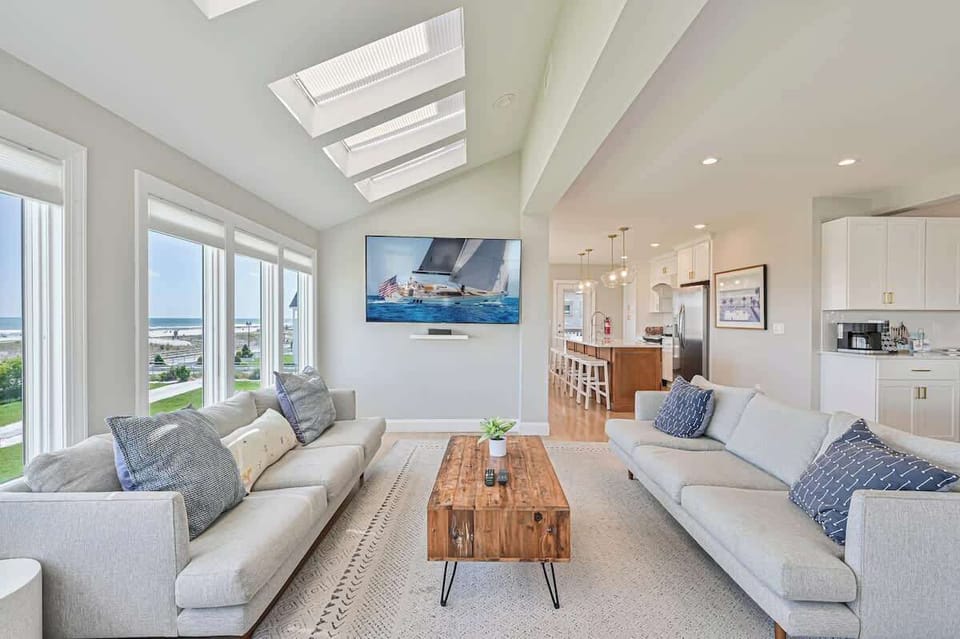 Living room with double couches and 70" TV