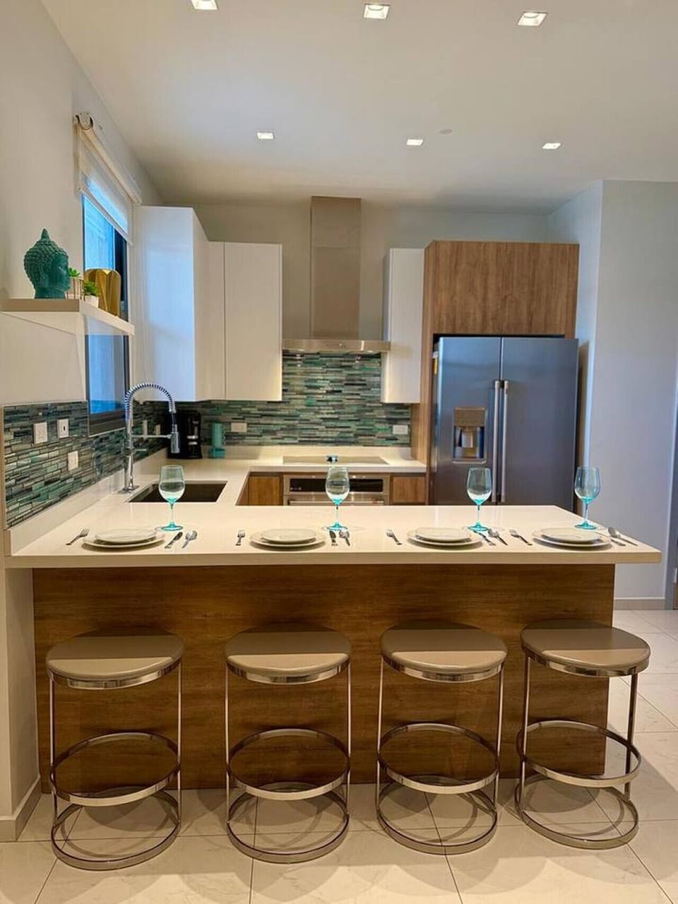 Gather around the kitchen island for easy meals, morning coffee, or a relaxed night in with good company.