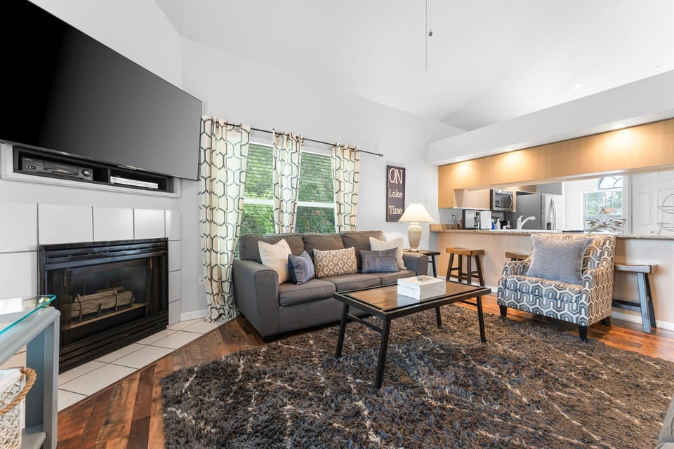 Unwind in the spacious living room with plush couches and a large smart TV for your entertainment.