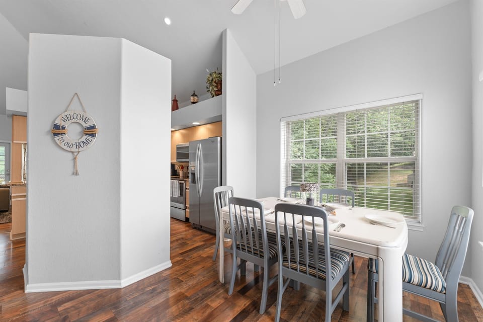 Step inside to a welcoming dining area and fully-equipped kitchen, perfect for family meals and gatherings.