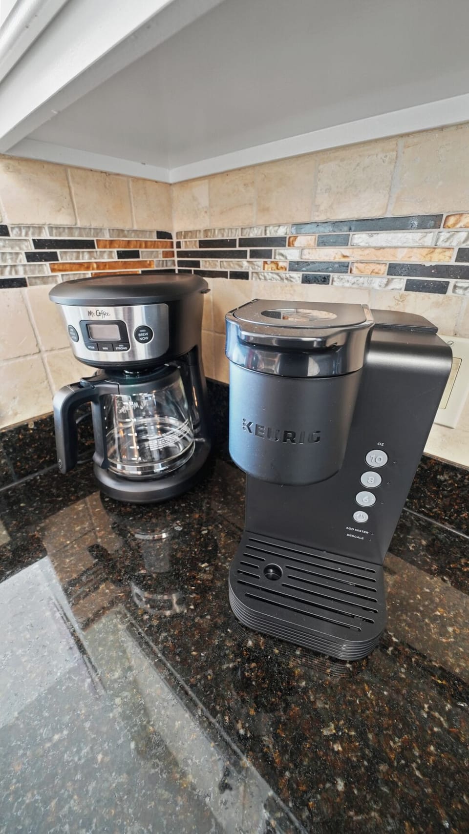 Start your mornings with fresh coffee from your well-equipped kitchen featuring both drip coffee maker and Keurig for your convenience.