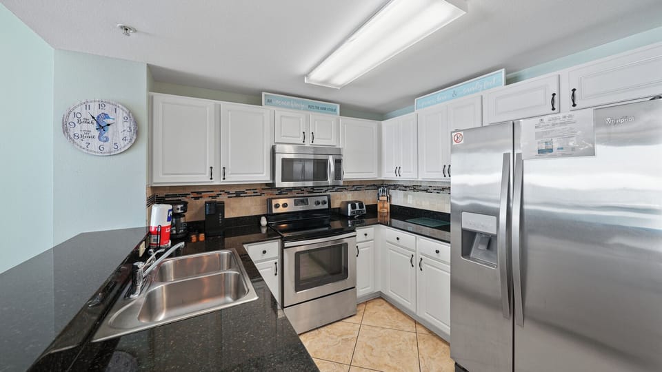 Your fully equipped kitchen features stainless steel appliances, granite countertops, and everything you need to prepare meals during your stay.