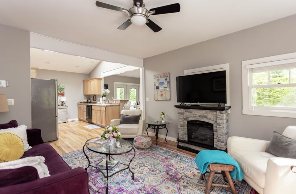 Charming living area with TV and fireplace