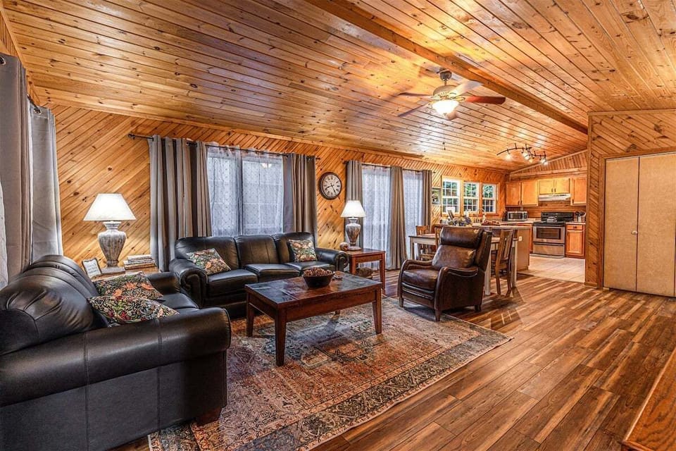 Open living space with plush seating and rustic wood finishes.