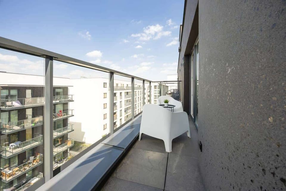 The balcony provides a perfect spot for enjoying the fresh air. 