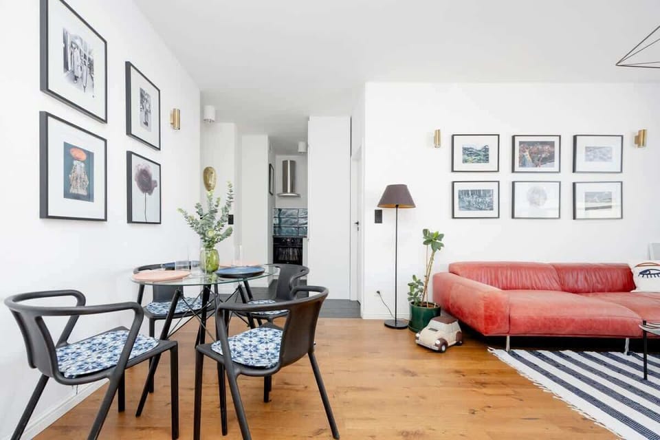 The living room offers a bright and airy space for relaxation.