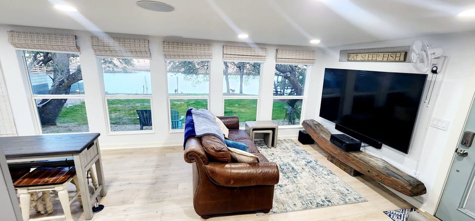 River View Room.  Large windows provide views of yard & river. 85" TV 5.1 sound.