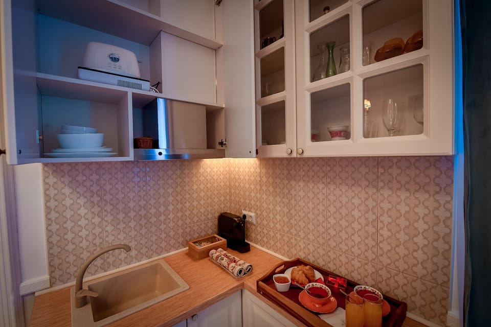 Standard Apartment | Private kitchen | Stovetop, coffee/tea maker, toaster, cleaning supplies