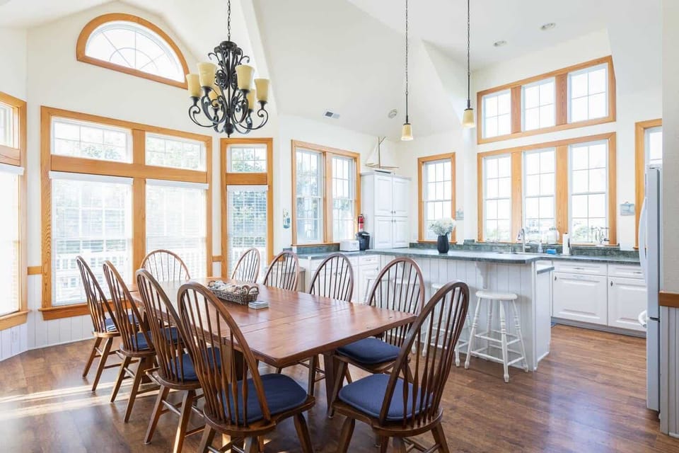 Top Level: Dining Space with Large Table and Barstools