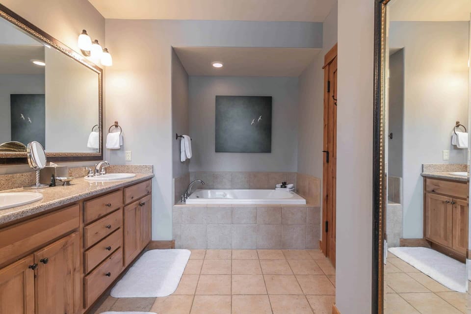 Ensuite bathroom features a soaking tub with jets.