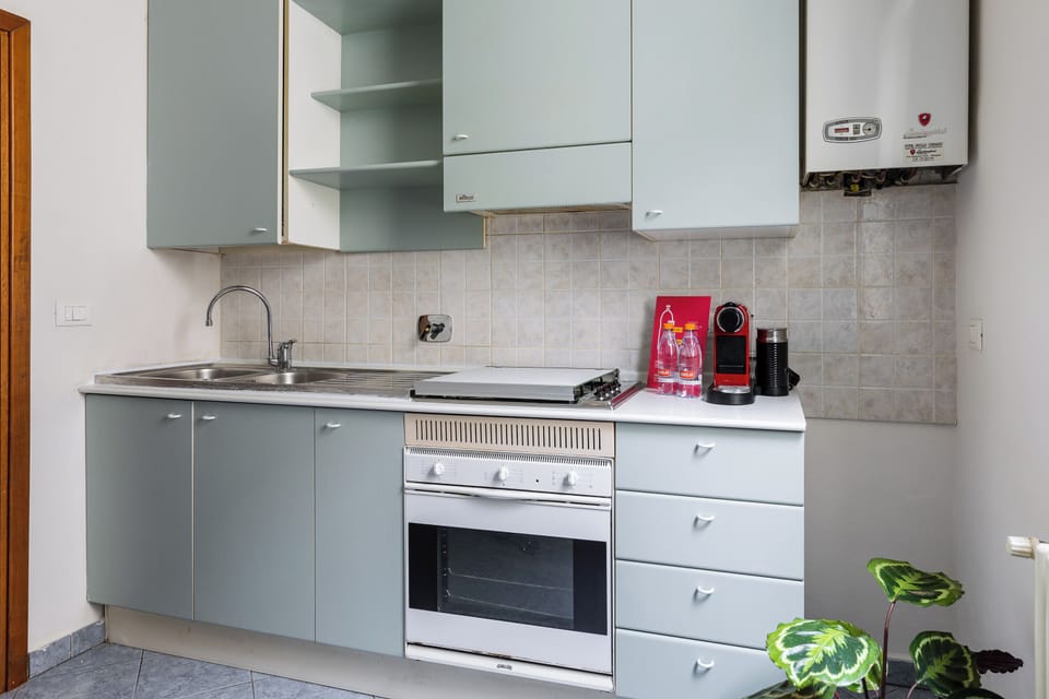 Apartment | Private kitchen | Electric kettle, dining tables