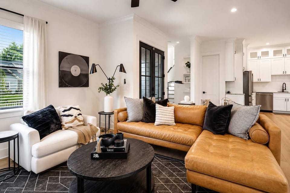Relax in stylish leather seating surrounded by vibrant décor, perfect for unwinding in the heart of Nashville.