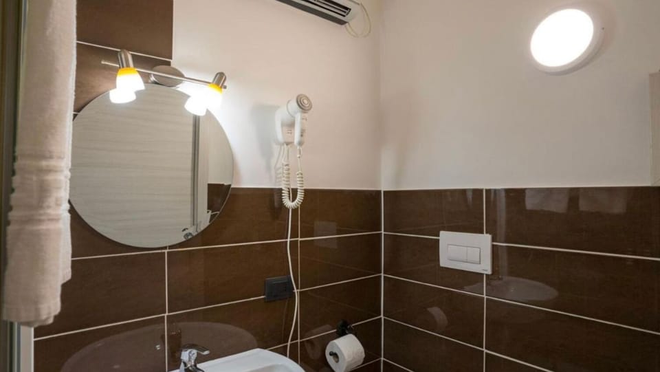 Separate tub and shower, hair dryer, bathrobes, bidet