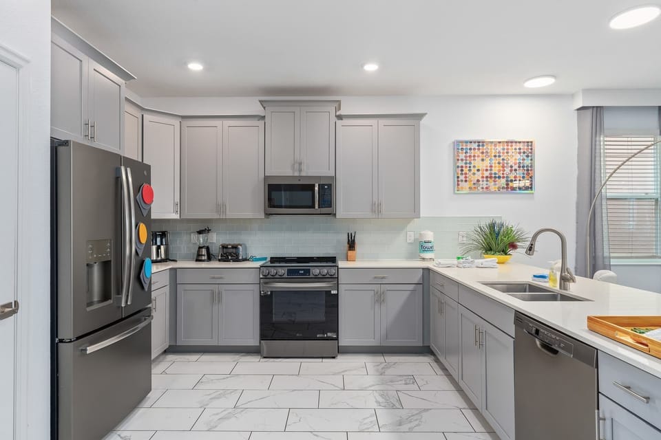 Cook like a pro with quartz countertops, stainless steel appliances, and every gadget you need.