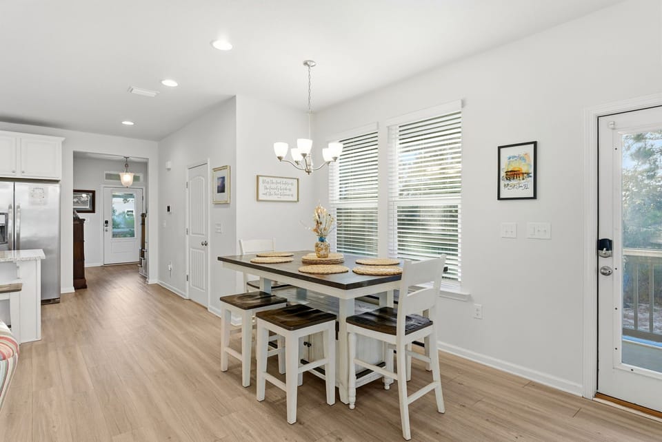 Your bright dining space flows perfectly into the kitchen, where you'll share meals in comfort under elegant lighting with views.