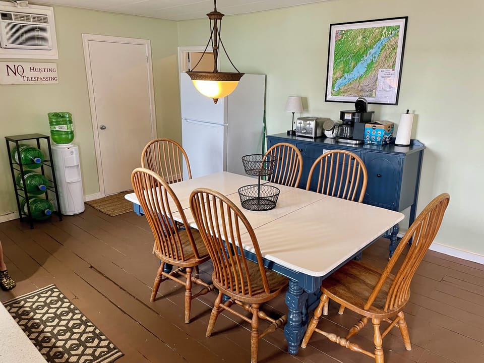 The large kitchen table is perfect for meals and for cards or board games. 