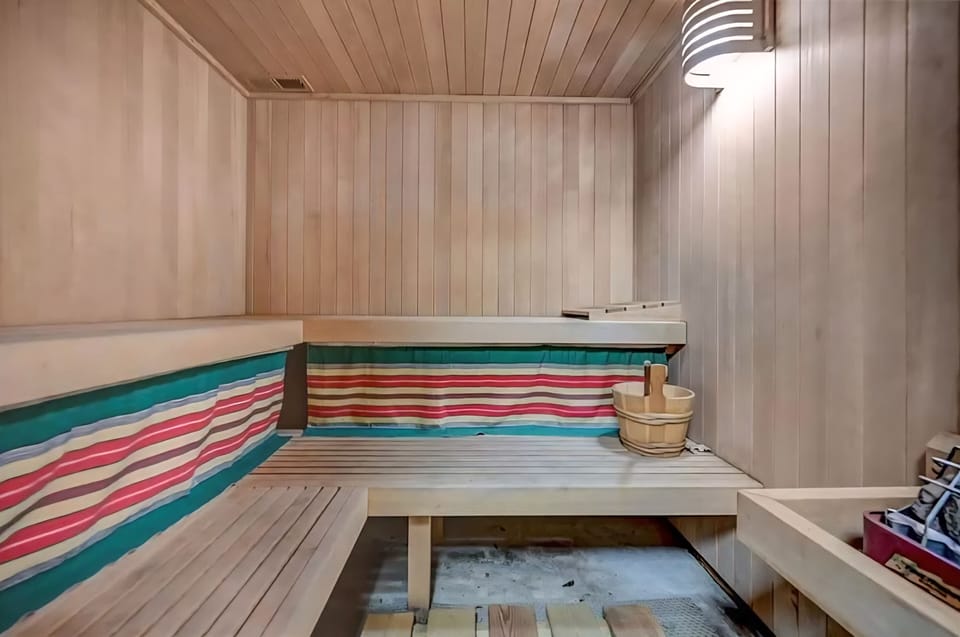 Relax and recharge in your private sauna with colorful cozy vibes.