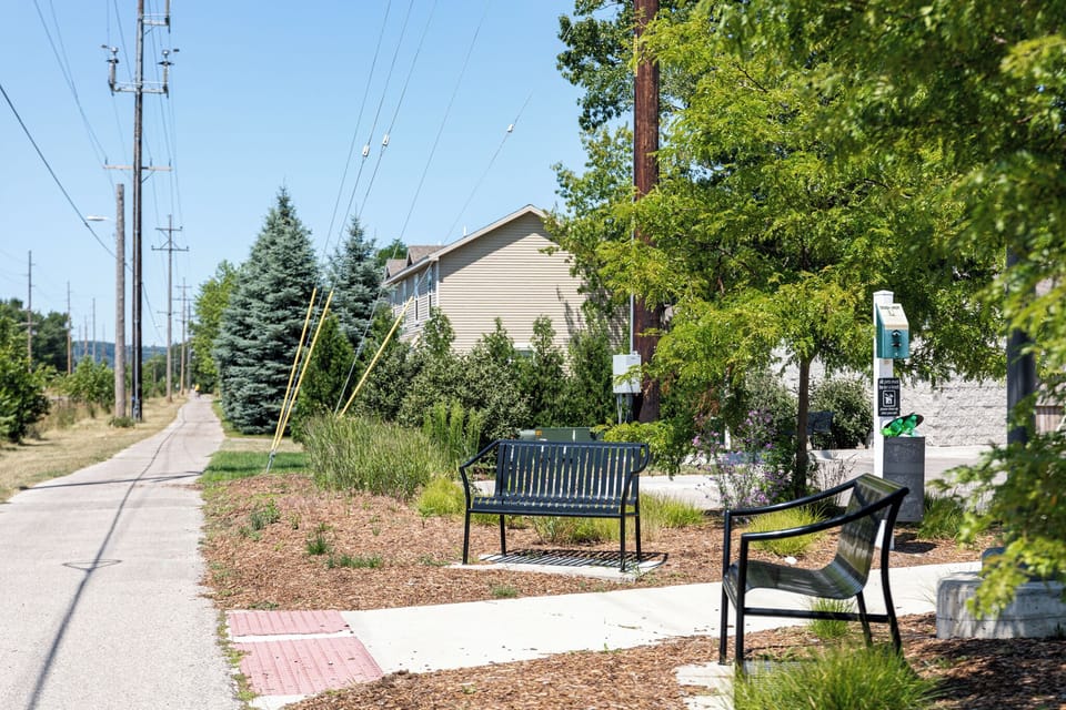 Nearby park area w/ benches & shaded green space