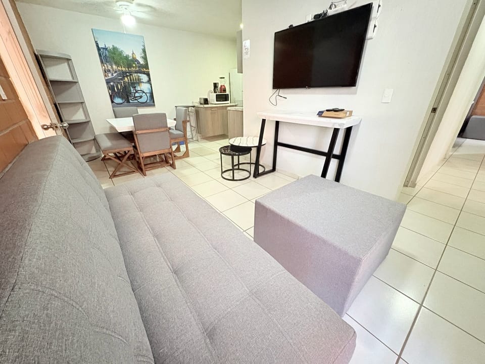Classic Apartment, 3 Bedrooms, Kitchen, City View | Living area | 32-inch TV with cable channels, streaming services