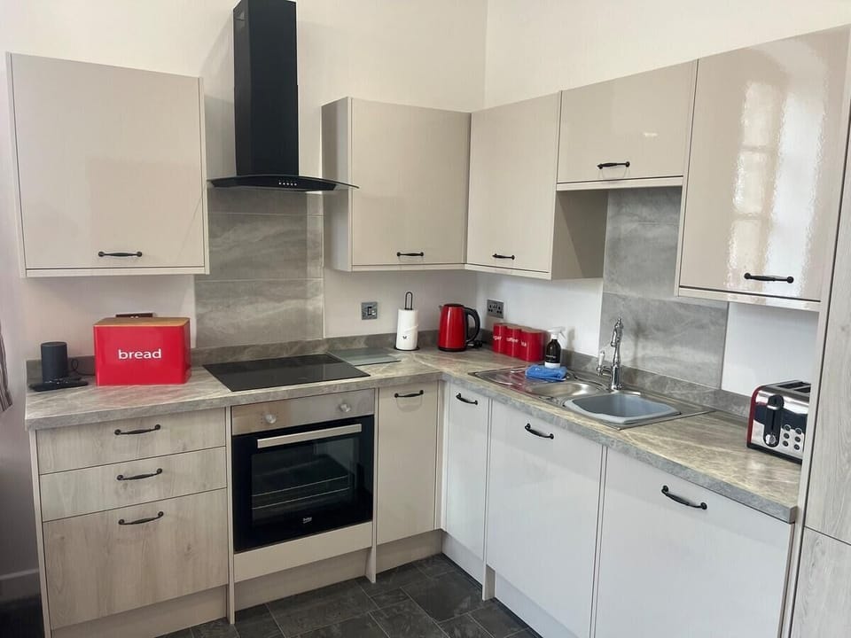 Spacious kitchen area , including large fridge freezer,  full size oven and hob and washing machine, kettle and toaster. 