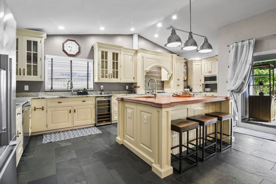 The fully stocked kitchen is perfect for cooking enthusiasts and a great place to hang out! 