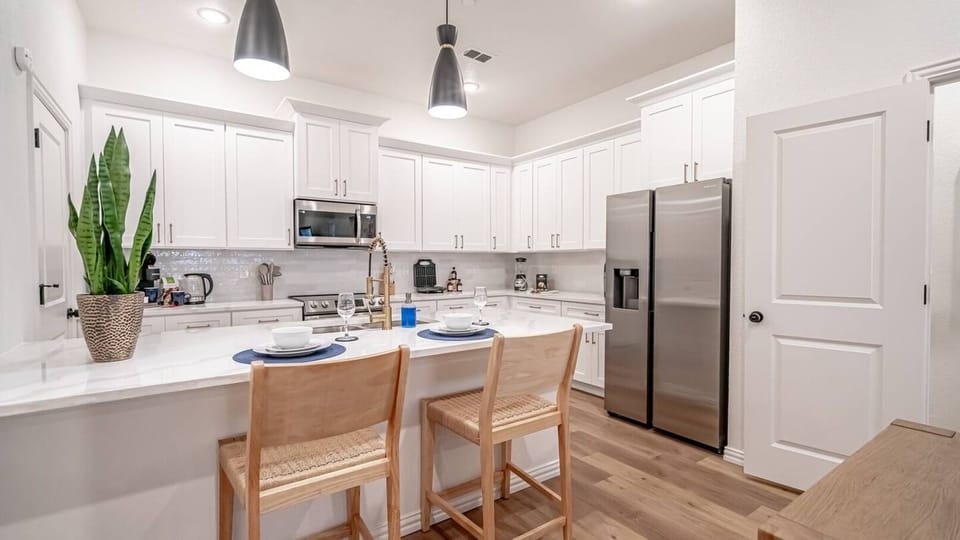 A fully equipped chef's kitchen with everything you need for a home-cooked meal or game day prep. Full-size appliances, cookware, utensils, and counter space to spare — because not every great meal should come from DoorDash.