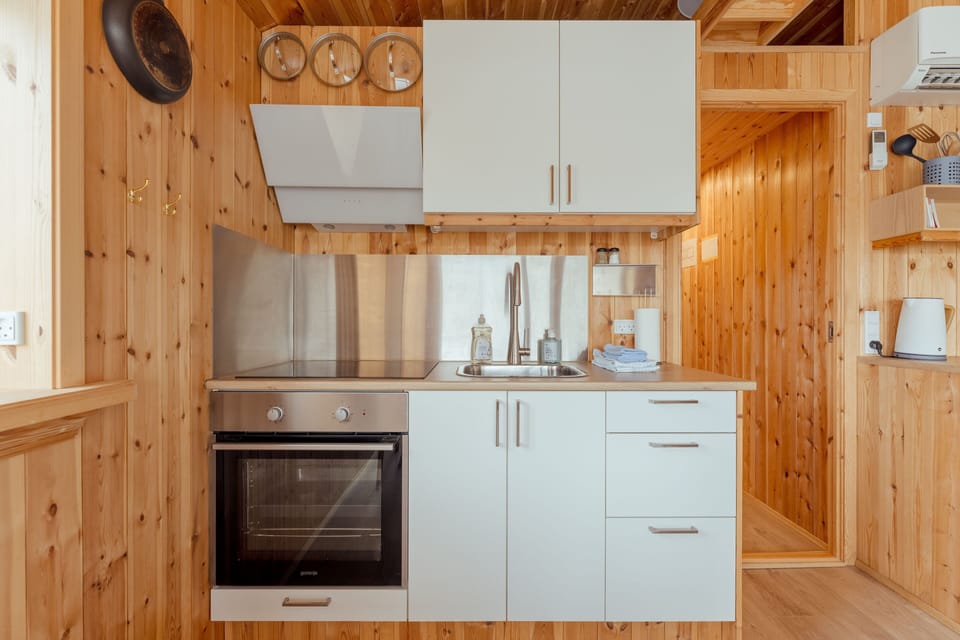 Bungalow | Private kitchen | Full-size fridge, electric kettle, dining table
