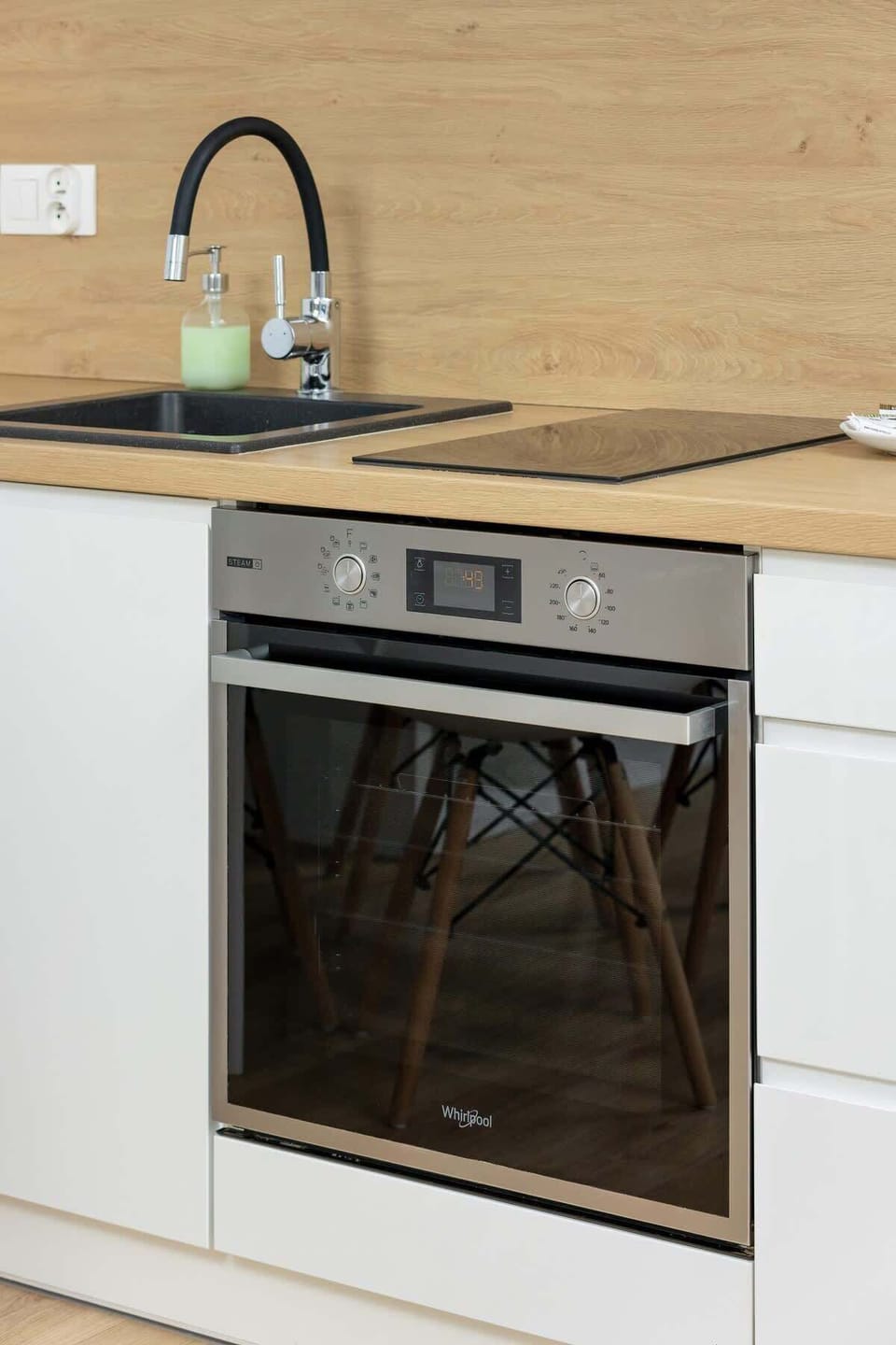 Kitchenette with plenty of kitchen utensils and dishes. 