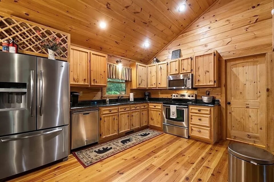 Full kitchen with granite countertops.