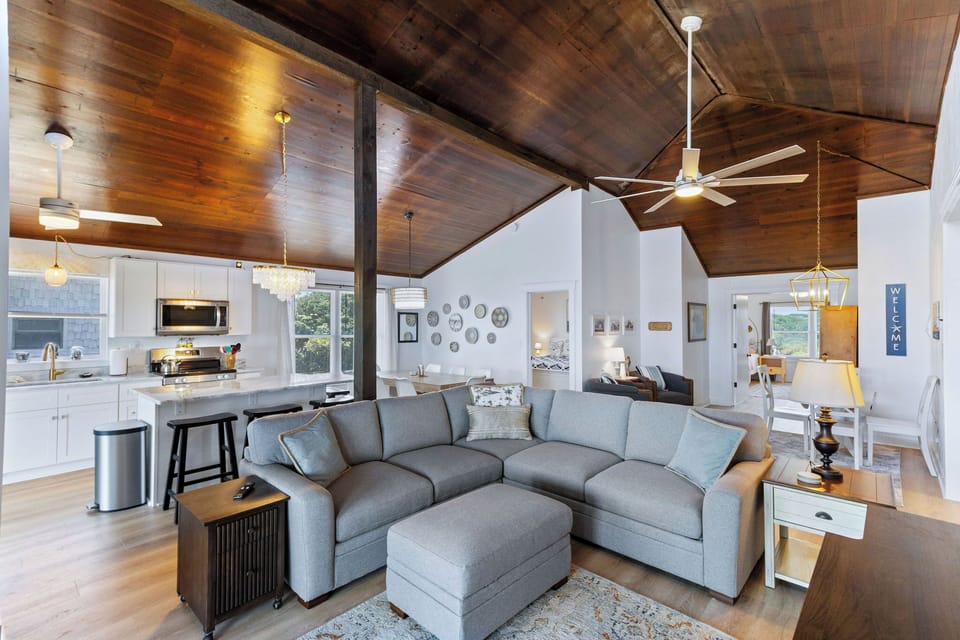 Living Area - Open the door to the open concept beauty, take in the high wooden ceilings, soft furnishings and thoughtful design.