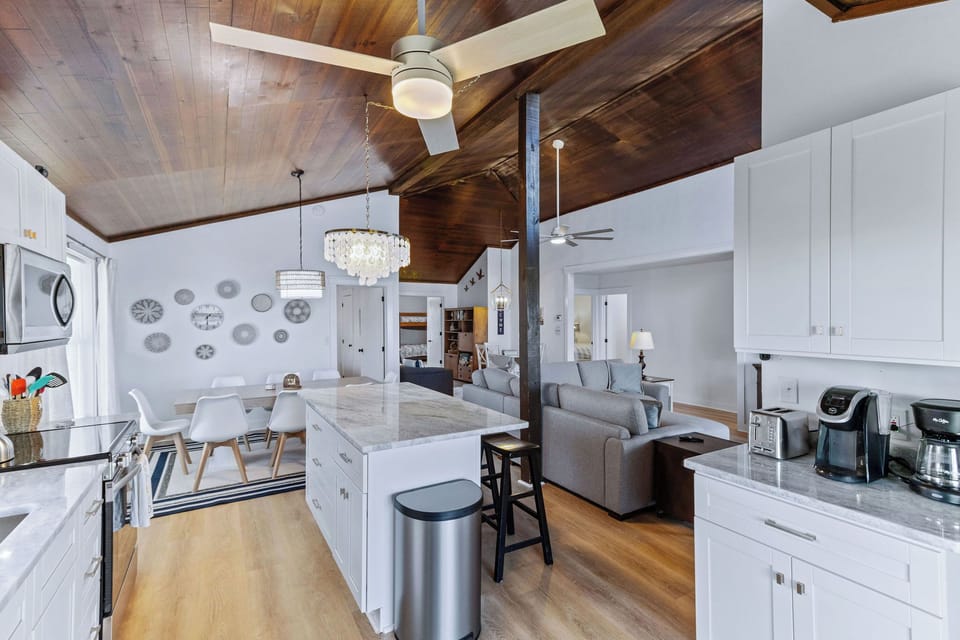 Kitchen - This kitchen is to die for with elegant lighting, stainless appliances, and an ocean view.
