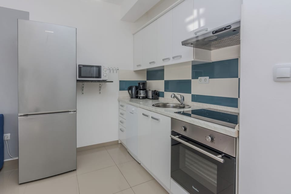 Comfort Apartment | Private kitchen | Coffee/tea maker, electric kettle, highchair