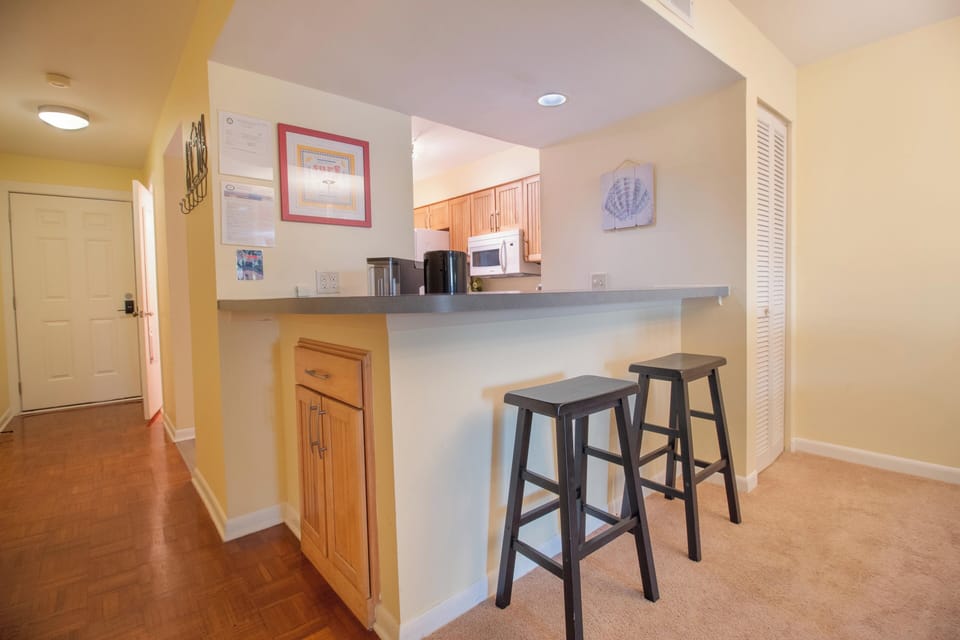 Pull up a stool at your kitchen breakfast bar and savor morning coffee while warm light fills the open, welcoming space.