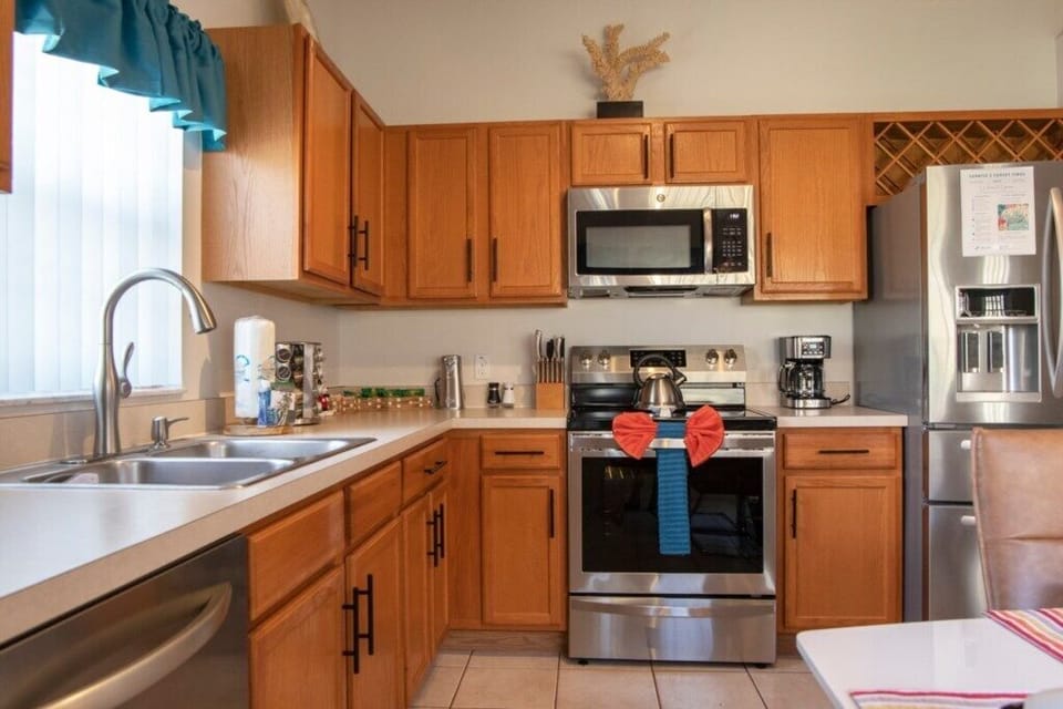 Fully equipped kitchen with modern appliances and ample storage.