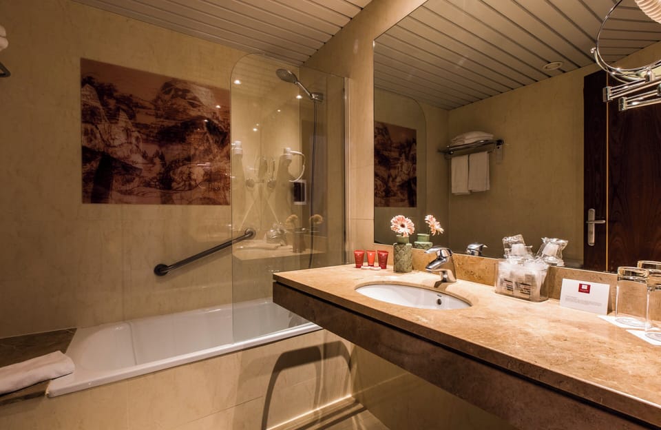 Combined shower/tub, hair dryer, towels, soap