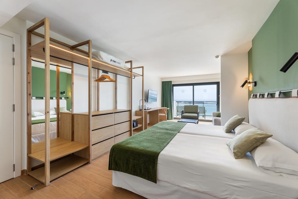 Junior Suite, Ocean View (3 adults and 1 child) | Minibar, in-room safe, desk, laptop workspace