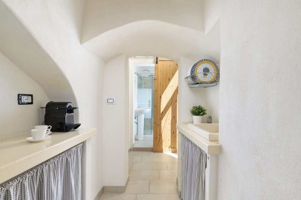 Apartment | Private kitchen | Full-size fridge, stovetop, espresso maker, cookware/dishes/utensils