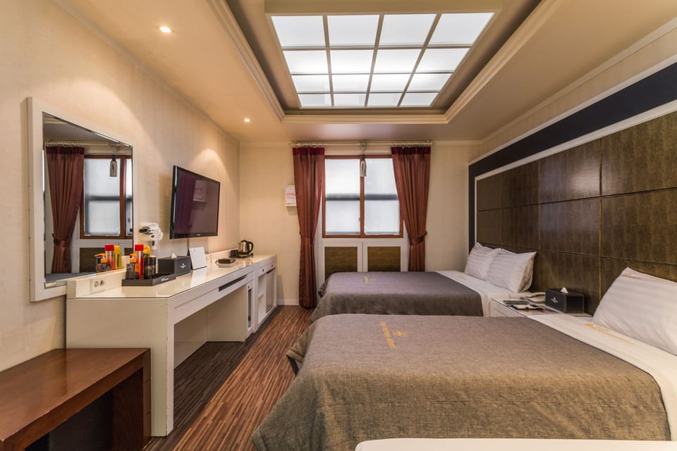 Family Room (Included Junior single bed) | Minibar, in-room safe, desk, blackout drapes