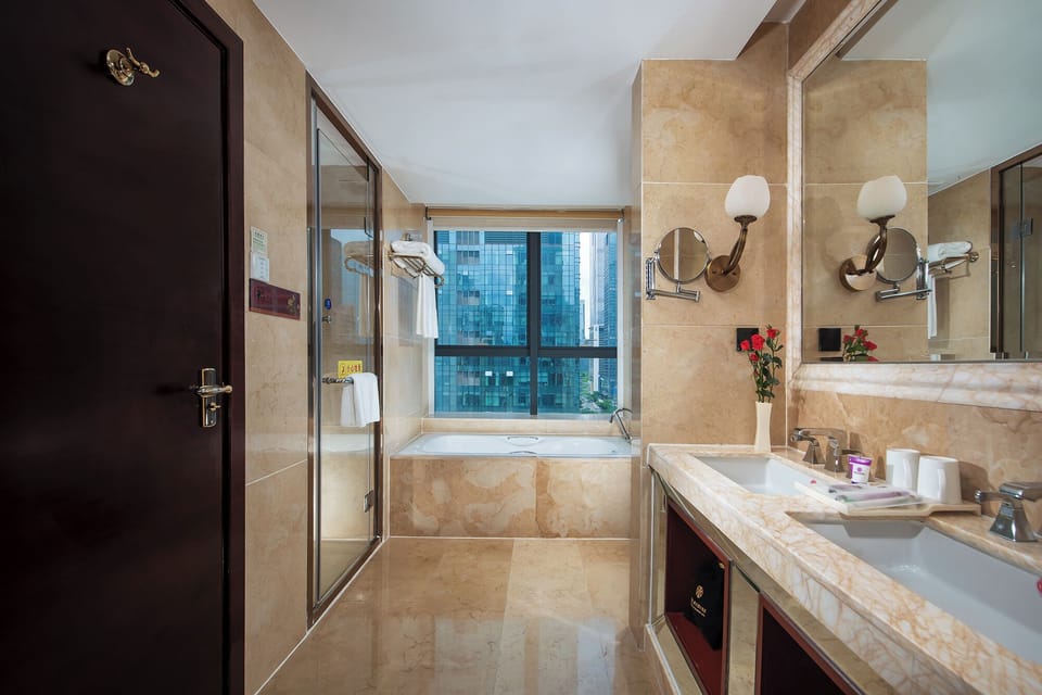 Business Suite, City View | Bathroom | Shower, rainfall showerhead, hair dryer, bathrobes