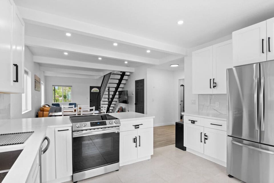 Fully Equipped Kitchen | Cooking Basics Includes stainless steel appliances and backyard access.