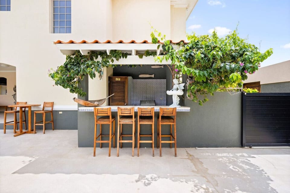 Indulge in the private bar area of Seaside Beach House, nestled near the poolside. Savor a drink amidst the tranquil ambiance, perfect for unwinding and enjoying the ultimate luxury experience.