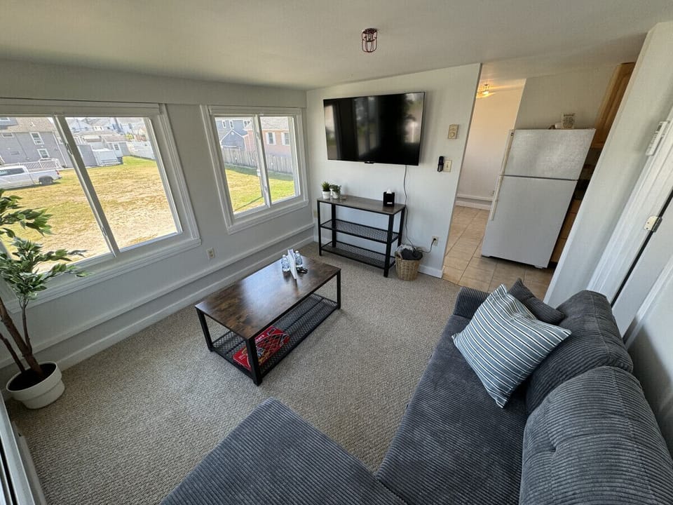 Relax in style in our open-concept living area, featuring a large Smart TV and high-speed WiFi for all your streaming needs.