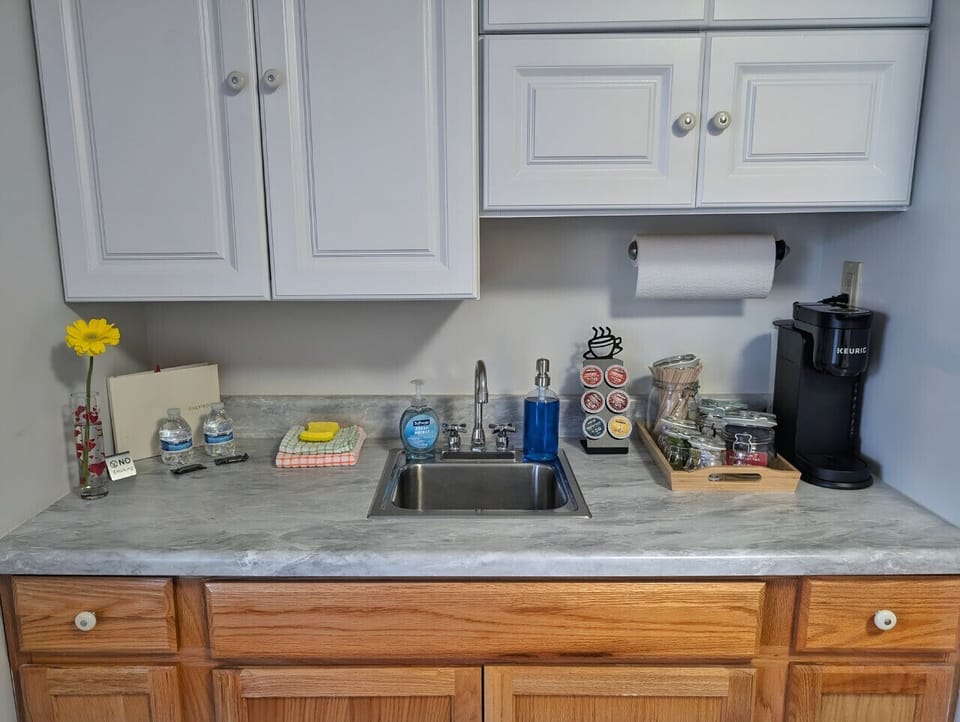 Small space, big convenience! Our modern kitchenette is fully equipped with a microwave, mini-fridge, and all the essential cookware for a quick and easy meal.